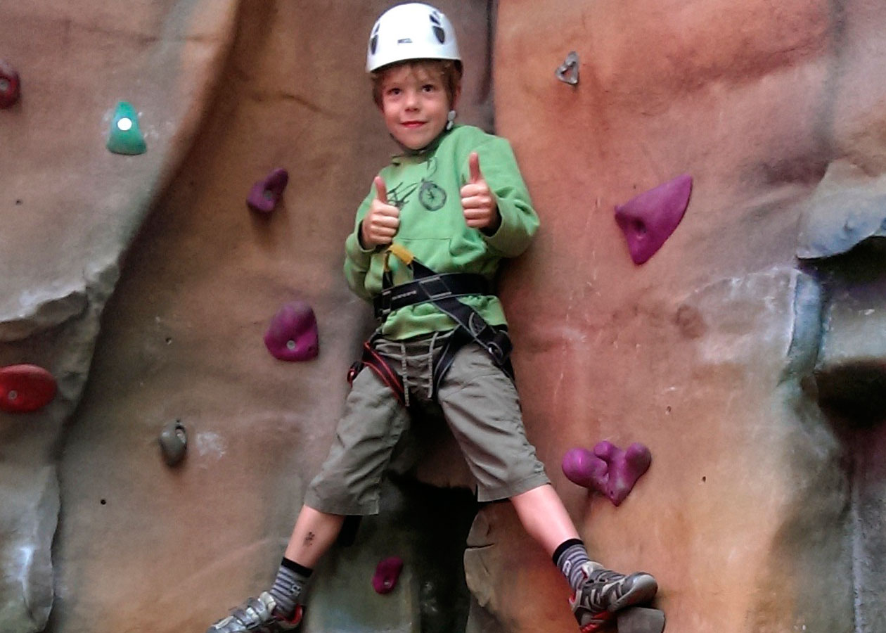 boy on climbing wall