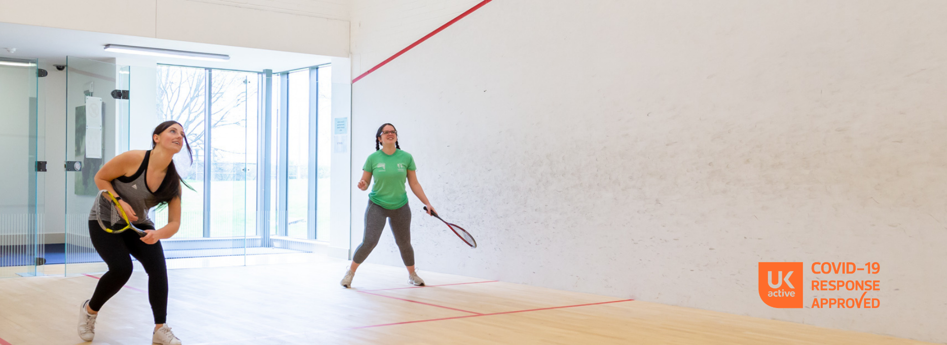 two girls on squash courts